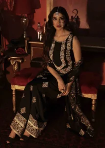 Black Pakistani Formal Dress Seated View With Gold Embroidery and Dupatta by Zeeniya